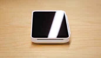 Close-up of Square POS card reader on table. Source: Tech.co