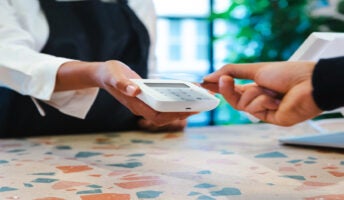 Person making card payment on POS. Source: Tech.co