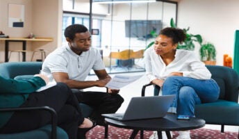 Two colleagues in a meeting. Source: Tech.co