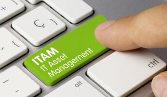 Words IT Asset Management on a green button on a keyboard