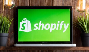 Shopify logo on laptop screen