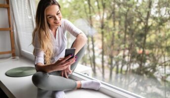 Lady using a mental health app on a window