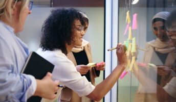 Employee writing on sticky notes