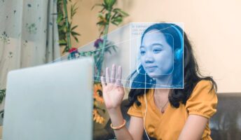 Women using a laptop with facial recognition