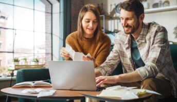 Man and woman using accounting software