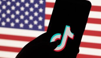 TikTok logo in front of the US flag