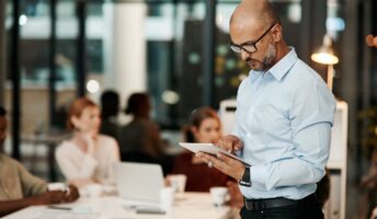 Man on tablet in office