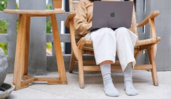 Lady working from home with a macbook