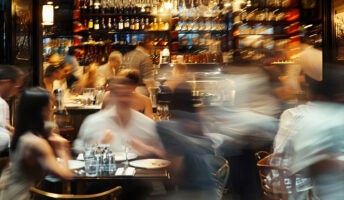 Blurred motion image of crowded bar