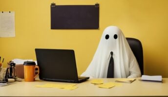 Ghost in tie working at desk