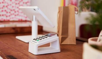 A picture of a Zettle Card reader mounted on a stand.