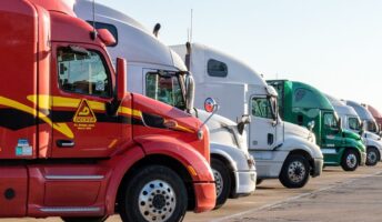 Semi-trucks, parked in a row