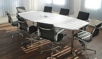 A workplace with an empty office table