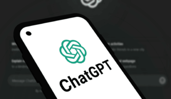 chatgpt logo on a phone screen, with the desktop version in the background.